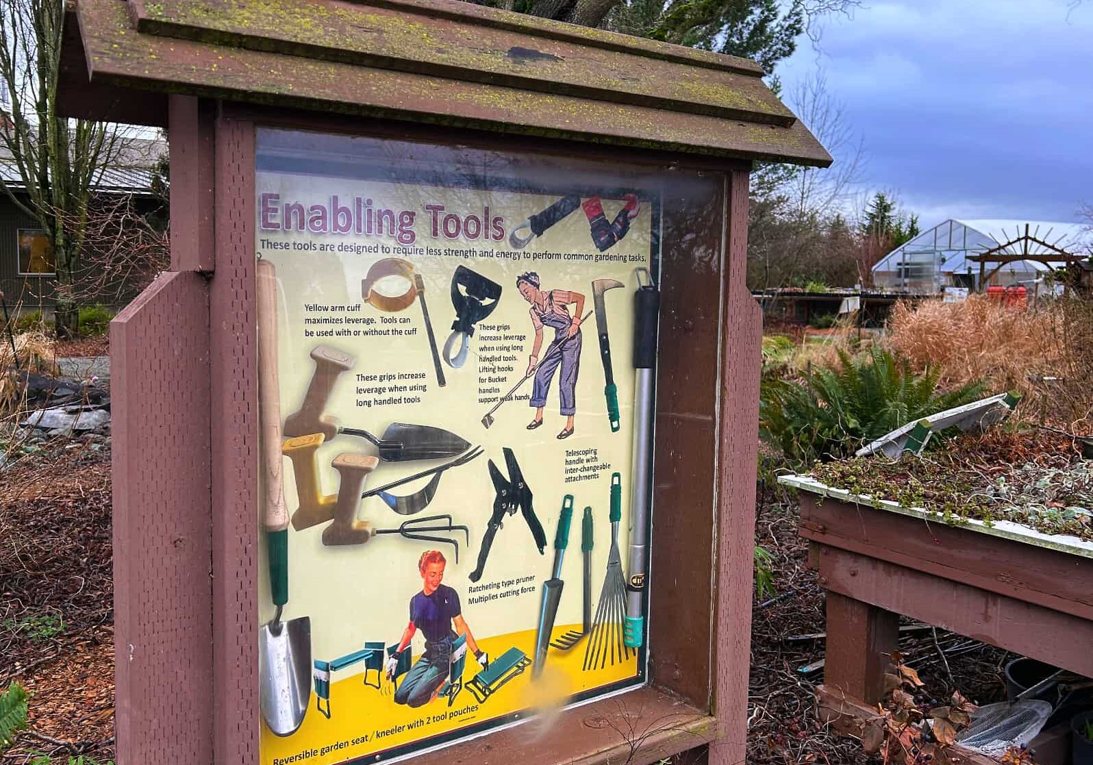 sign showing garden tools