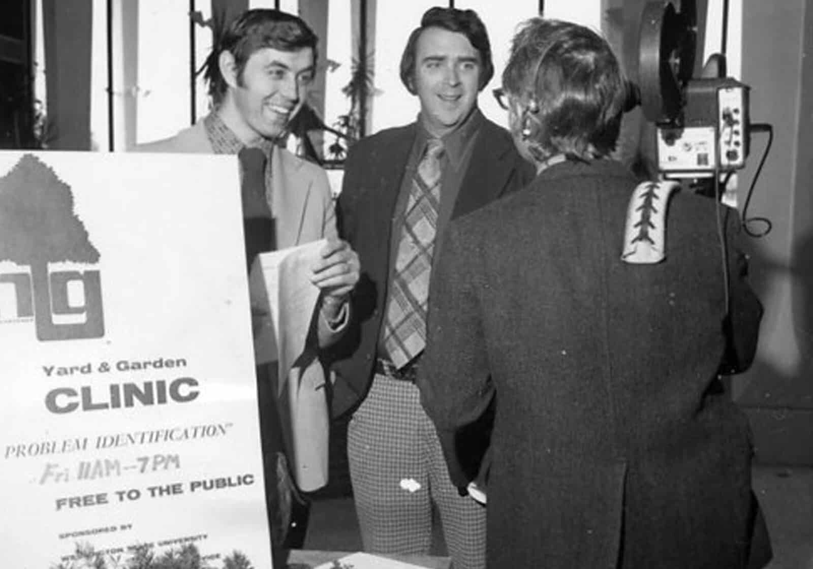 070723_pic6 1973 photo of men answer reporters questions